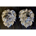 LIONS HEAD WALL RELIEFS, a pair, 49cm x 42cm.