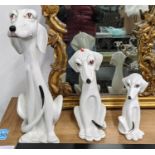 CERAMIC DALMATION DOGS, a set of three, Italian, of graduated form, largest 58cm H, underglaze