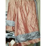 CURTAINS, a pair, each approx 190cm x 238cm drop in a pink silken fabric with blue border, lined and