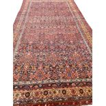 ANTIQUE PERSIAN FEREGHAN DESIGN CARPET, 410cm x 215cm.