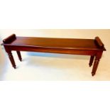 HALL BENCH, Regency style mahogany with bolster handles and reeded supports, 137cm W x 32cm D x 51cm