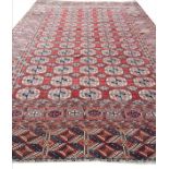 ANTIQUE TURKMAN BOKHARA CARPET, 350cm x 235cm.