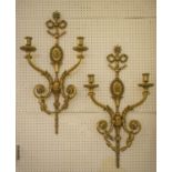 WALL LIGHTS, 78cm H x 41cm a pair, early 20th century Louis XVI style gilt bronze with twin sconces.