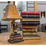 OCCASIONAL TABLE, in the form of a pile of faux books 33cm x 33cm x 52cm H and an elephant lamp 60cm