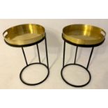 TRAY TABLES, 51cm H x 40cm diam, a pair, the gilt metal trays raised on ebonised bases. (2)