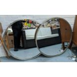 CIRCULAR MIRRORS, a pair, contemporary design having silver effect rims, bevelled edge glass, 80cm