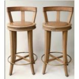 BAR STOOLS, a pair, by Wychwood design Oxfordshire in studded leather and solid oak, 102cm H seat