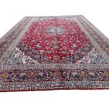 FINE PERSIAN KASHAN CARPET, 387cm x 278cm.