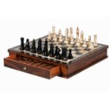 CHESS SET, with a single drawer, comprising bone and horn chess pieces, board 14cm high, 39cm