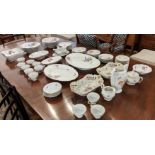 PART DINNER SERVICE, comprising twelve hand painted foliate KPM soup bowls, nine dinner plates,