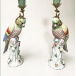 PARROT CANDLESTICKS, a pair, Continental style painted porcelain and gilt metal mounted, 36cm H. (2)