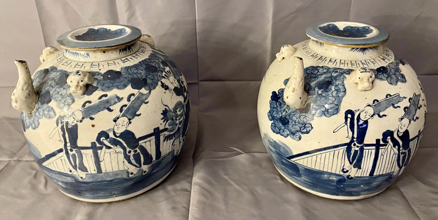 KETTLE POTS, a pair, Chinese export style blue and white, 30cm x 24cm. (2)