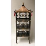 PAGODA SHELVES, Japanese style lacquered and gilt with three shelves, pierced lattice supports and