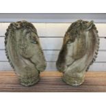 HORSE HEAD STONE FINIALS, a pair, weathered stone, 90cm H. (2)