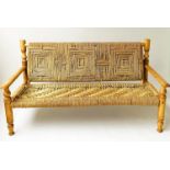 WINDOW BENCH, rattan framed cane bound and woven strung with arms, 157cm W.