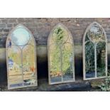 ARCHITECTURAL GARDEN MIRRORS, a set of three, 122cm x 56cm, gothic style, aged metal frames. (3)