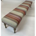 OKA WINDOW SEAT, striped kilim upholstery on turned legs and castors, 221cm x 45cm x 45cm.