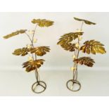 CANDLE HOLDERS, tropical leaf, a pair, 131cm high, 70cm diameter, gilt metal, each with five pierced