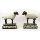 CLOISONNE ENAMEL SHEEP, late Qing Dynasty Chinese Republic period, a pair, on stands with Arabic