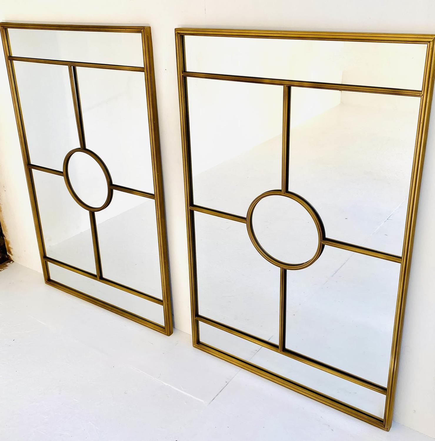 ARCHITECTURAL WALL MIRRORS, a pair, 110cm x 70cm, gilt metal frames, 1950s French style. (2)
