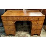 CENTRE DESK, 61cm x 78cm H x 123cm, Art Deco burr walnut of nine drawers.