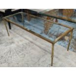 MAISON JANSEN STYLE LOW TABLE, gilt metal and glass, 122cm x 46.5cm x 42.5.