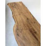 COFFEE TABLE, 1960s yew wood tree section on tapering splay supports, 181cm W x 58cm D x 43cm H.