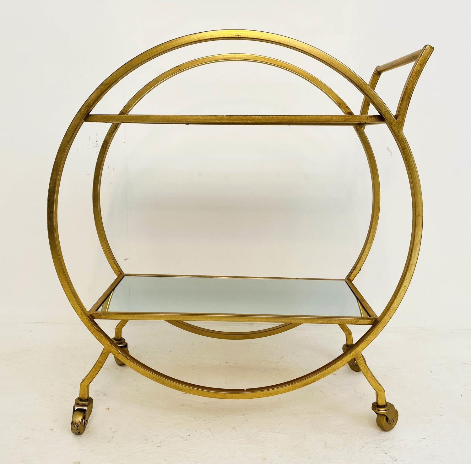 COCKTAIL TROLLEY, French art deco style, gilt metal, mirrored shelves, 75cm x 70cm x 34cm.