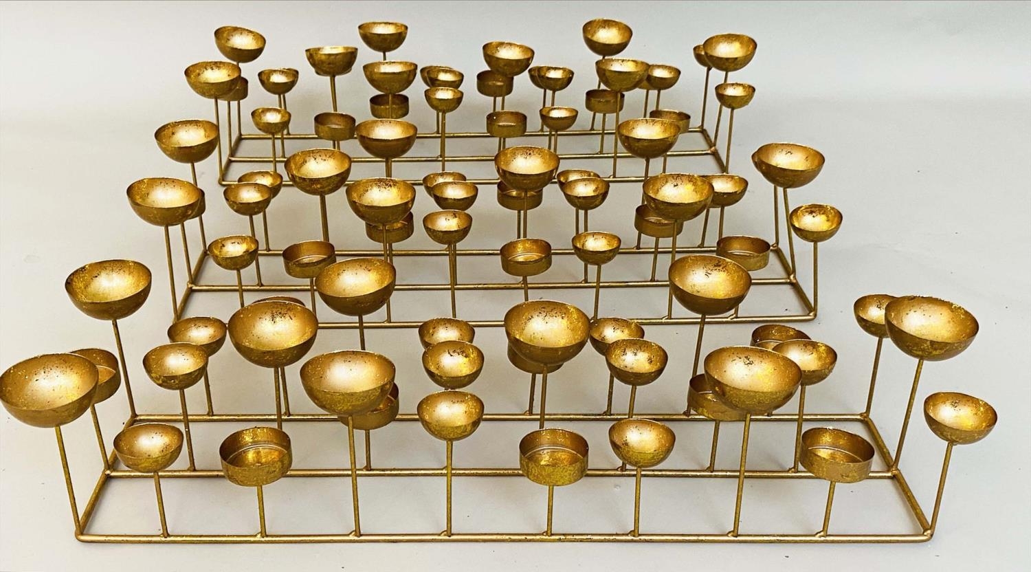 TEA LIGHT CANDLE STANDS, a set of three, contemporary, gilt metal, 13cm x 56cm x 18cm. (3) - Image 2 of 4