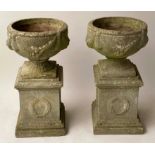 GARDEN URNS, a pair, 72cm x 40cm, reconstituted stone on plinths. (2)