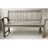 GARDEN BENCH, silvery weathered teak, slatted with curved arms, 139cm W.