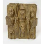 BENIN BRONZE PLAQUE, depicting three warriors, 37cm h x 27cm.