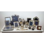 PICTURE FRAMES, nine various with silver surrounds, a silver pocket watch date stand and embossed