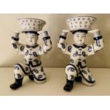 TRINKET DISHES, a pair, in the form Chinese gentleman holding rice baskets, ceramic, 33cm x 23cm x