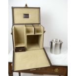 TRAVELLING BAR, brown canvas and leather, with compartmentalized interior, with drawer and ice