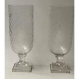 STORM LAMPS, a pair, cut glass cylindrical with stepped bases, 41cm H. (2)