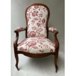 ARMCHAIR, 19th century French walnut with raspberry pink woven upholstery and scroll carved arms,