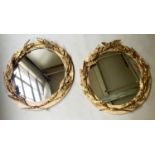 WALL MIRRORS, a pair, circular antique, neoclassical carved, giltwood laurel wreath with faux marble
