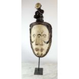 NTUMU MASK, Gabon, carved and painted wood, 70cm x 28cm.