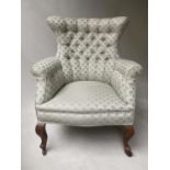 ARMCHAIR, Edwardian mahogany with shell motif upholstery and buttoned back, 69cm W.