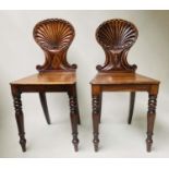 HALL CHAIRS, a pair, George III mahogany with shell carved backs, 39cm W. (2)