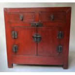 SCRIBES CABINET, early 20th century Chinese scarlet lacquered with two drawers and two doors, 90cm x