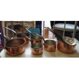 BATTERIE DE CUISINE, comprising of a set of five graduated copper pans, the largest 20cm diam and