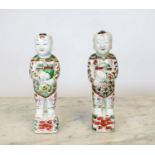 CHINESE 'LAUGHING BOYS', a pair famille-verte matched on possibly Kangxi, 28cm H. (2)