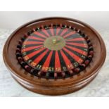 ROULETTE, 50cm W x 15cm H, 19th century, the mahogany case with a lid with turned handle and a hole,