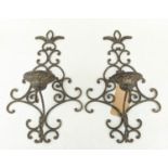 OKA WALL SCONCES, a pair, each 53cm x 51cm, metal. (2)