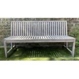 GARDEN BENCH BY CONRAN, weathered teak 1970's style slatted and strut construction, 146cm W.