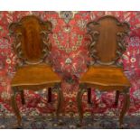 HALL CHAIRS, 88cm H x 42cm, a pair, Victorian mahogany with foliage carved backs. (2)