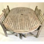 GARDEN SET, comprising a weathered teak rounded rectangular table with four armchairs all by 'Barlow