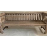 GARDEN BENCH, 183cm W, weathered teak of substantial slatted construction with flat top arms and